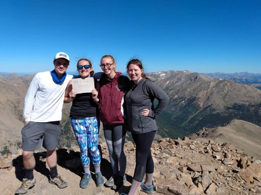 people hiking a 14er