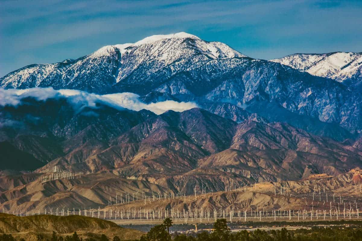 Beautiful snow-covered Mount San Jacinto rises above the Coachella Valley and San Gorgonio Pass Wind Farm, Palm Desert, California