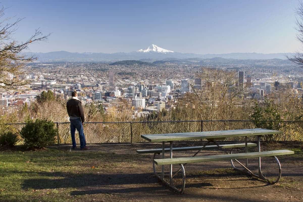 Man overlookng Portland, Oregon from Pittock Mansion.